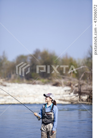 A woman fishing 47006072