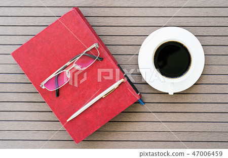 Office desk table with notebook, coffee cup 47006459