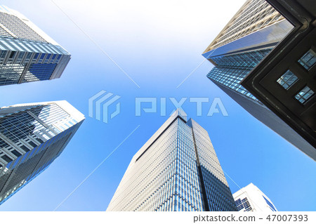 Landscape of the office town looking up at a skyscraper Landscape of the office town looking up at a skyscraper 47007393