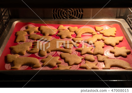 Christmas baking. Dough and form for ginger cookies. Roll out the dough. Christmas baking. Dough and form for ginger cookies. Roll out the dough. 47008015