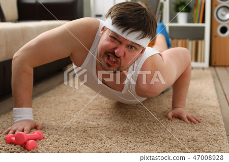 A young handsome man with excess weight 47008928