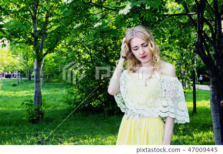 Sad girl in a city Park. Sad girl in a city Park. 47009445