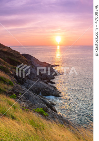 Sunset at the sea in Phuket, Thailand. 47009846