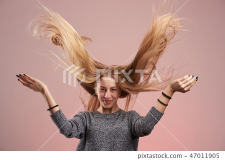 Woman with flying hair Woman with flying hair 47011905