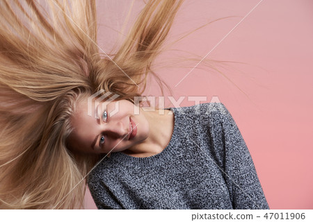 Young woman shake her hair Young woman shake her hair 47011906