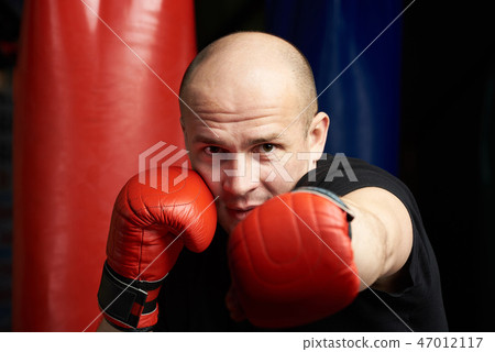 Close-up of man making boxing punch Close-up of man making boxing punch 47012117