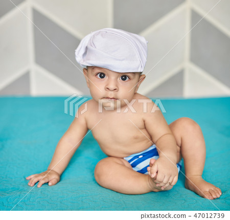 Baby boy in cloth diaper 47012739