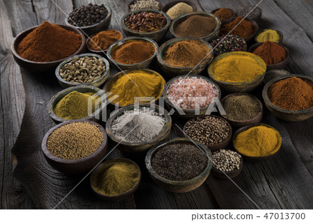 Aromatic spices on wooden background Aromatic spices on wooden background 47013700