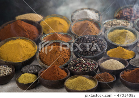 Smoke, Aromatic spices on wooden background Smoke, Aromatic spices on wooden background 47014082