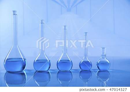 Laboratory beakers, microscope, blue background 47014327