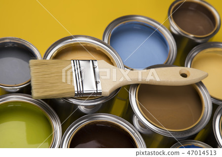 Tin cans with paint and brushes, yellow background 47014513