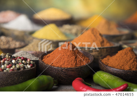 Assortment of spices in wooden bowl background Assortment of spices in wooden bowl background 47014655