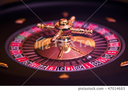 Roulette wheel running in a casino Roulette wheel running in a casino 47014683