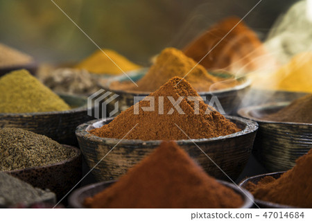 Variety of spices and herbs on kitchen table Variety of spices and herbs on kitchen table 47014684