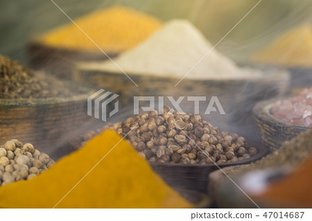 Smoke, Aromatic spices on wooden background Smoke, Aromatic spices on wooden background 47014687