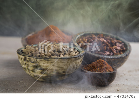 Aromatic spices, smoke and Still Life background Aromatic spices, smoke and Still Life background 47014702