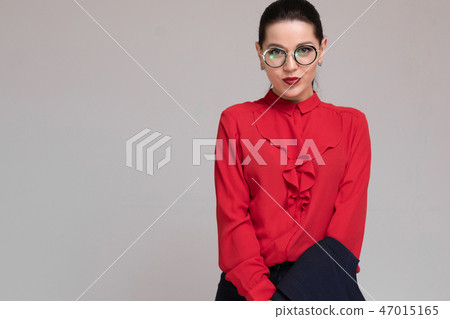 Horizontal Portrait of a beautiful girl in bright business clothes isolated on a light background Horizontal Portrait of a beautiful girl in bright business clothes isolated on a light background 47015165
