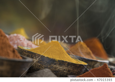 Smoke, Aromatic spices on wooden background 47015393