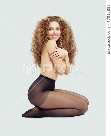 Cheerful woman in black tights smiling  47015883