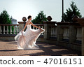 fashion photo of beautiful woman in wedding dress posing outdoor. 47016151
