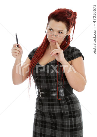 Young woman in glasses with pen Young woman in glasses with pen 47016672
