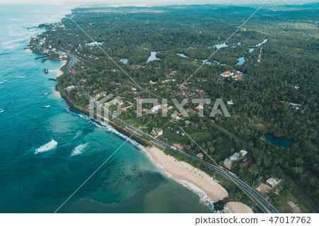Aerial view of  coastline and fisherman village 47017762