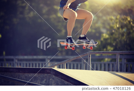 skateboarder skateboarding on skatepark 47018126