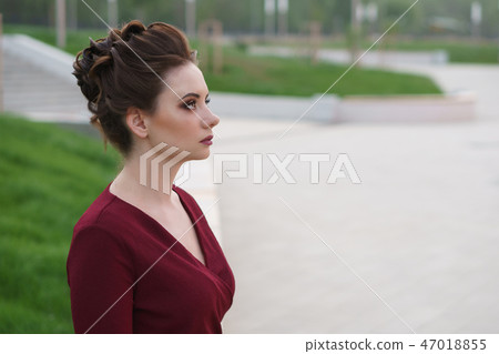 Girl in a red dress. Girl in a red dress. 47018855