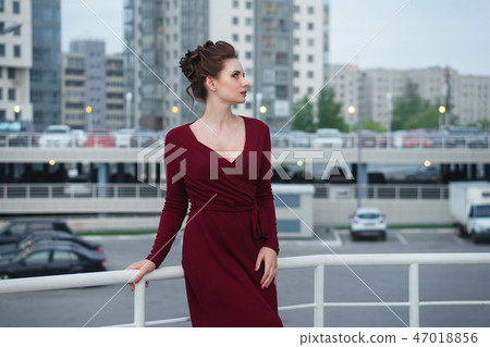 Girl in a red dress. Girl in a red dress. 47018856