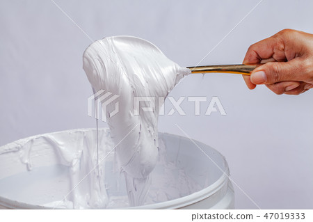 white ink in the barrel in white backgroud 47019333
