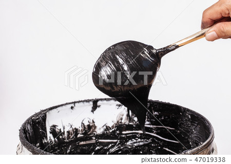 black ink dripping from spoon black ink dripping from spoon 47019338