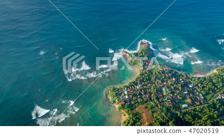 aerial view of coastline and fisherman village 47020519