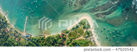 aerial view of coastline and fisherman village aerial view of coastline and fisherman village 47020542