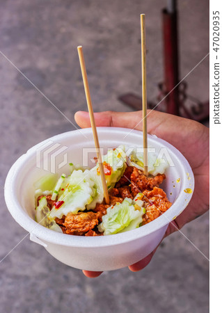 Tod Mun Kala in foam cup, Thai cuisine. Tod Mun Kala in foam cup, Thai cuisine. 47020935