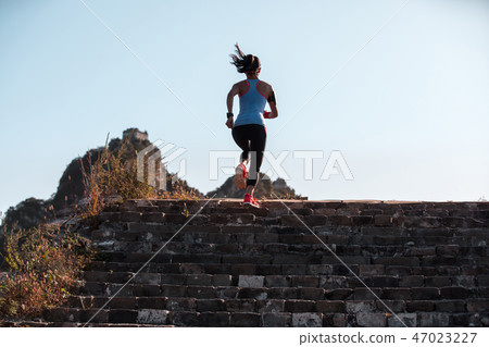 fitness woman runner running to mountain top fitness woman runner running to mountain top 47023227