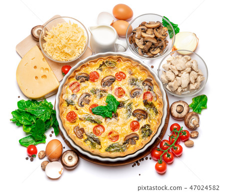 Baked homemade quiche pie in ceramic baking form, eggs and cream Baked homemade quiche pie in ceramic baking form, eggs and cream 47024582