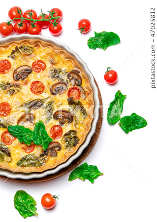 Baked homemade quiche pie in ceramic baking form Baked homemade quiche pie in ceramic baking form 47025812