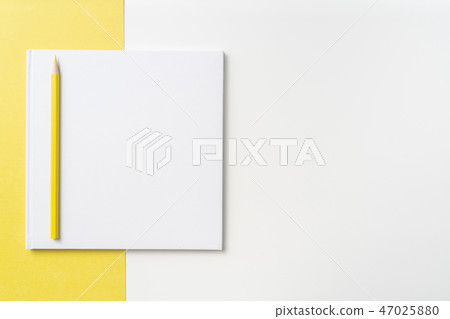 Top view of white hardcover notebook, pencil Top view of white hardcover notebook, pencil 47025880