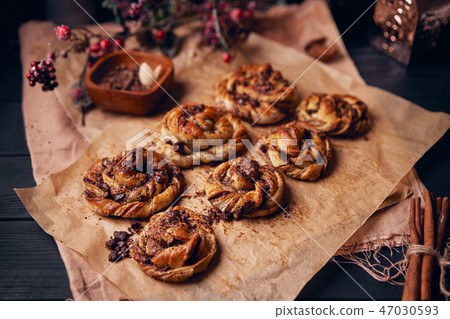 Cinnabon with chocolate as cake food concept. Close up view Cinnabon with chocolate as cake food concept. Close up view 47030593