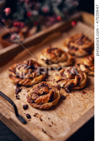 Cinnabon with chocolate as cake food concept. Close up view Cinnabon with chocolate as cake food concept. Close up view 47030647