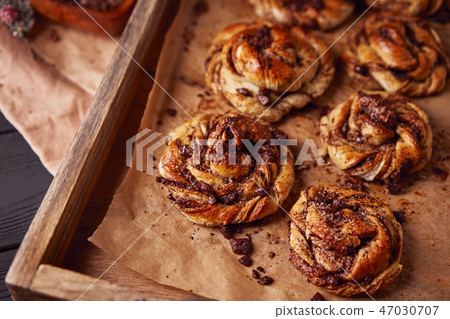 Cinnabon with chocolate as cake food concept. Close up view Cinnabon with chocolate as cake food concept. Close up view 47030707