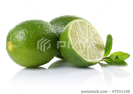 Whole and slice of lime with mint leaves Whole and slice of lime with mint leaves 47031198