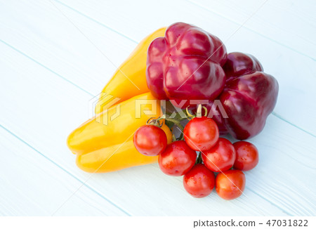 Pepper and tomatoes on a wooden turquoise  47031822