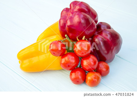 Pepper and tomatoes on a wooden turquoise  47031824