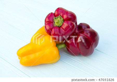 Pepper on a wooden turquoise background. proper  47031826