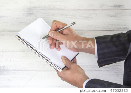 Businessman writing pen in notebook. Success Businessman writing pen in notebook. Success 47032283