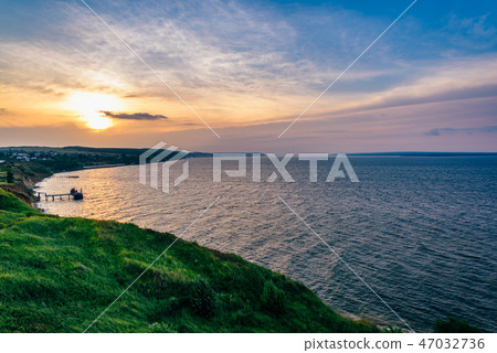 Hilly shore next to the rivers estuary Hilly shore next to the rivers estuary 47032736