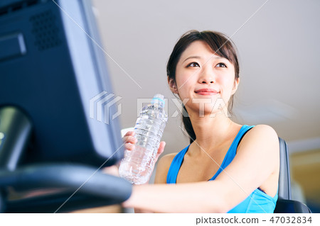 Exercise bike woman water Exercise bike woman water 47032834