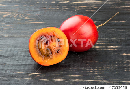 Fruit tamarillo with half Fruit tamarillo with half 47033056