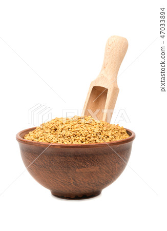 Grains of fenugreek in bowl Grains of fenugreek in bowl 47033894